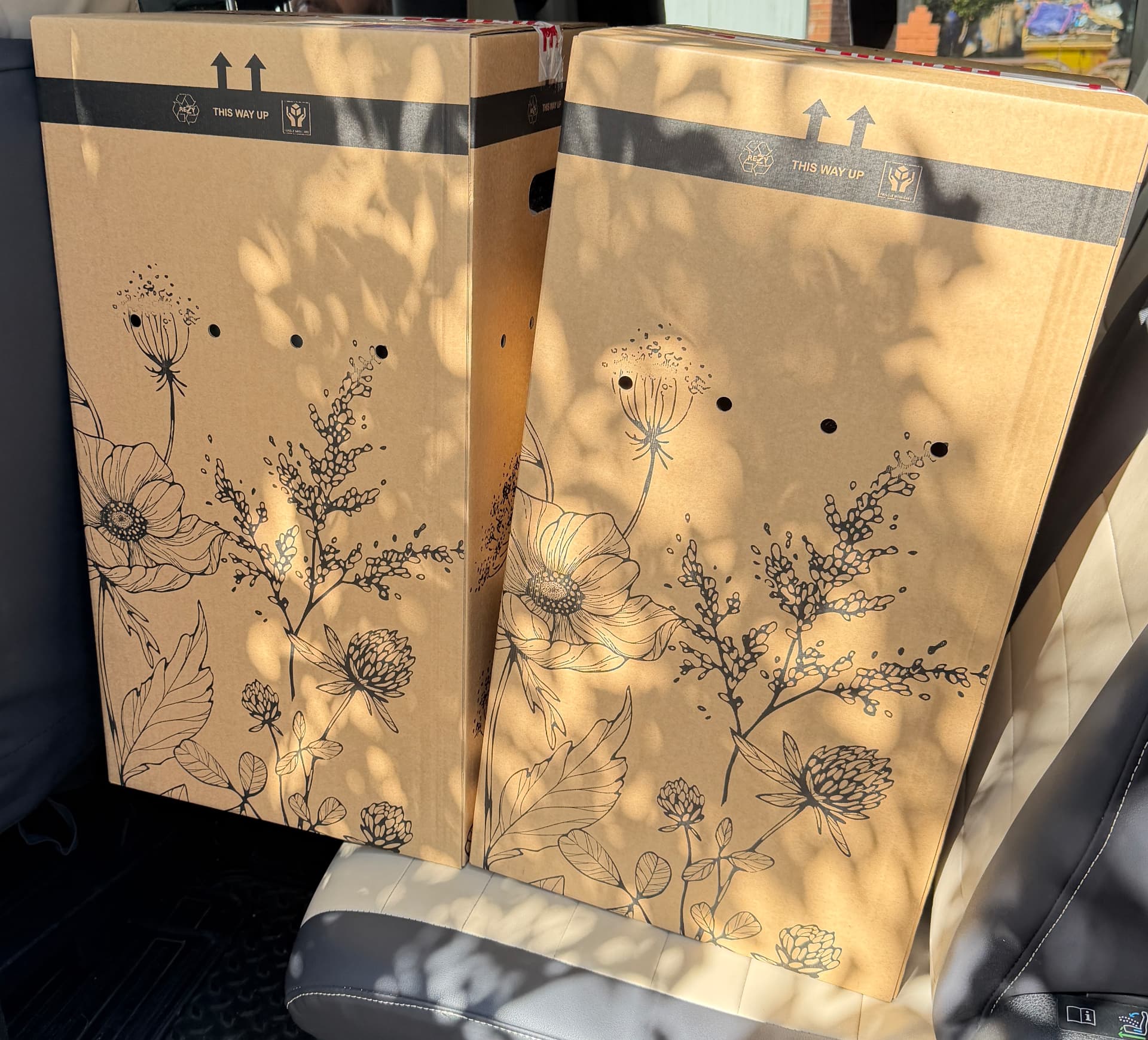 Two tall floral postal boxes prepared for bouquet delivery